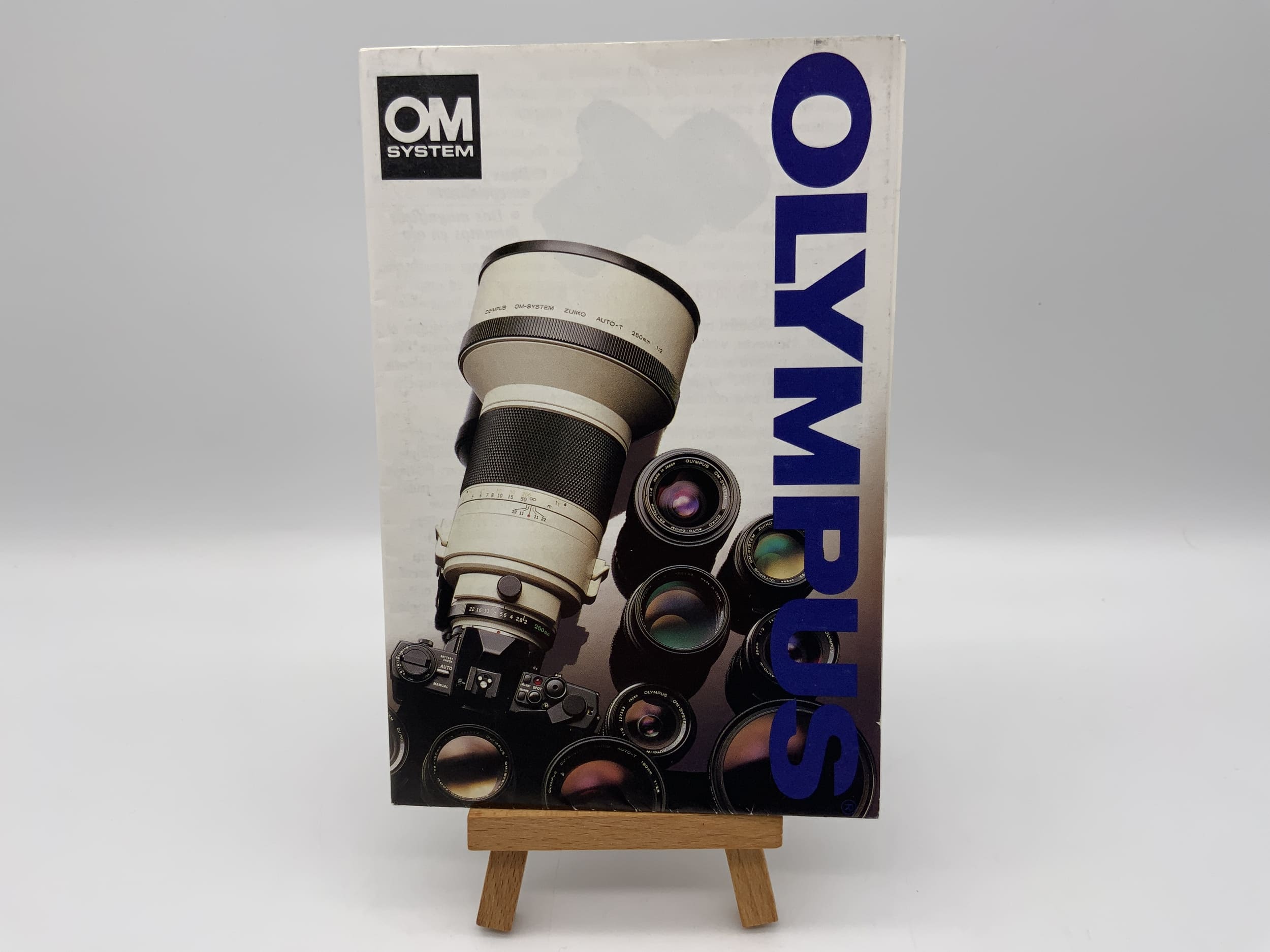 Olympus OM System Broschüre Deutsch Gebrauchsanweisung Magazin